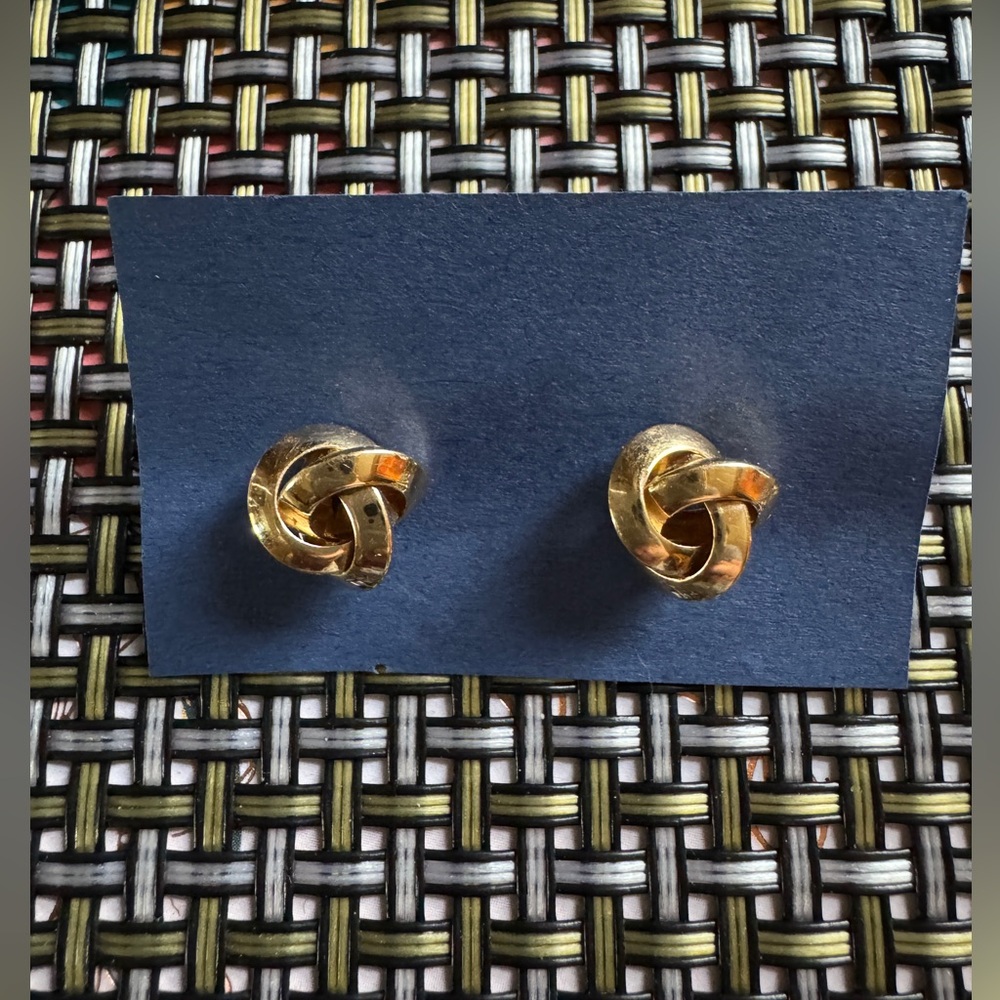 Gold tone knot twisted pierced earrings